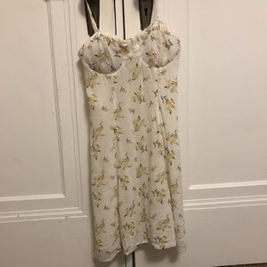 loose white dress with yellow flowers